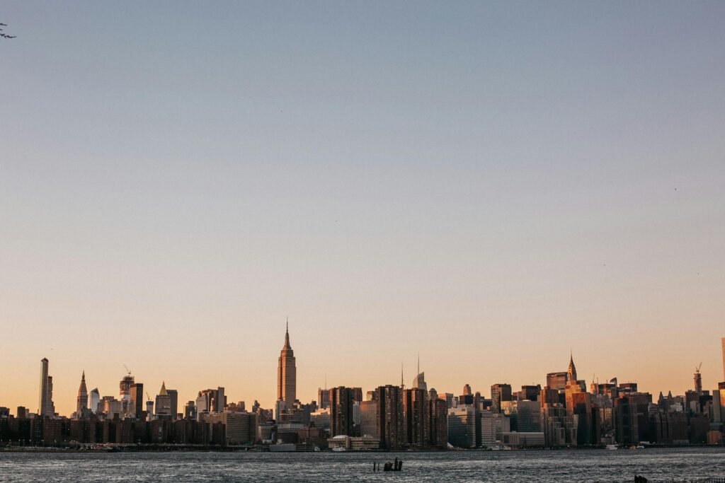 Stunning view of New York City skyline at sunset, featuring the iconic Empire State Building.